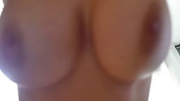 Busty chick with blue hair is slowly taking off her sexy lingerie in front of the camera