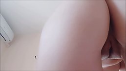 Frisky girl with a perfectly shaved pussy is farting in front of the camera, just for fun