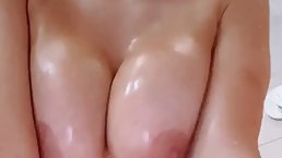 Beautiful, blonde milf with big, firm tits is having a shower in front of the camera