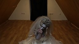 Blonde babe is sucking a big, fake dick while dressed up in a Halloween zombi- bride costume
