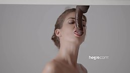 Lovely lady is sucking a hard dick through a gloryhole and listening to her lover's moans