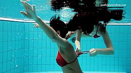 Frisky girls got naked in the swimming pool and had some fun while no one was watching