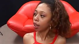 Ebony babe in sexy, red clothes is getting fucked hard by a group of white guys