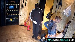 Frisky teen is spreading her legs wide open for random strangers through a gloryhole in the club