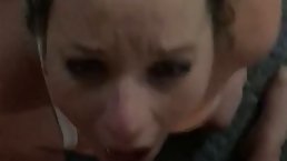 Mature woman is sucking her lover's hard dick while kneeling in front of him, just for fun