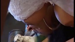 Busty milf is fucking a horny guy in his garage after playing with his dick a bit