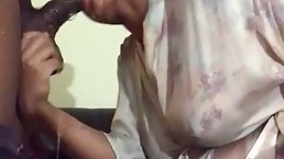 Stunning housewife is wearing a silky robe while sucking a big, black meat stick like a pro
