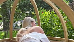 Frisky blonde babe is gently sucking a rock hard dick before riding it on the porch