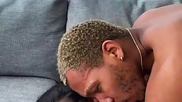 Busty woman is wearing shoes with high heels while having sex with a black guy