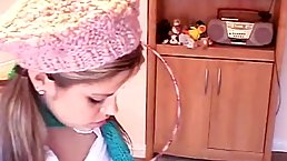 Pigtailed college girl is masturbating with a sex toy, on the floor, instead of studying for exams