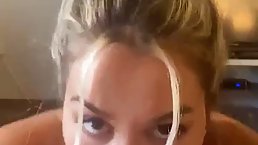 POV of a sexy blonde with perky tits who loves sucking dick while staring at the camera