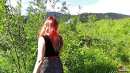 Red haired teen in black, fishnet stockings is having sex in the nature, during the day