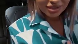 Passionate woman with big boobs is doing naughty stuff in the parking lot and enjoying it