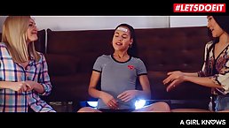 Three aroused girls are pleasing each other in the living room, in the middle of the day