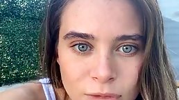 Brunette with blue eyes is being a very naughty girl in front of the camera