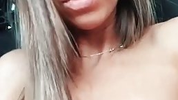 Small titted brunette is using a vibrator while masturbating in the back of a car