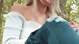 Seductive babe with blonde hair and big boobs is about to start tuching herself in the nature
