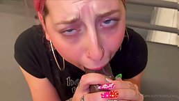 Cock loving chick with pink hair is giving a blowjob to a black guy, just for fun