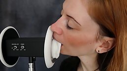 Red haired babe is sucking and licking a fake ear and it sounds so fucking good