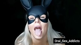 Ravishing blonde babe with a black mask on her face is sucking her lover's hard dick
