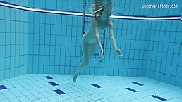 Young girls swimming naked in the pool