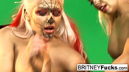 Busty gold painted lesbian blondes lap each other up