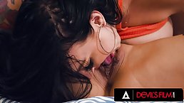 Horny tattooed busty MILFs fuck each other with a strap-on