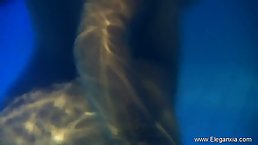 Sexy Indian girl bathing in a pool with waterfall