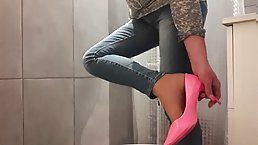 Amateur girl pissing in her jeans and pink high heels
