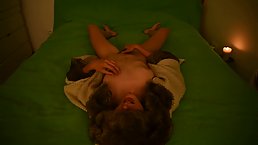 Amateur teen wearing fur coat masturbating and moaning on the bed