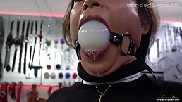 Sexy brunette MILF gets tied up and ballgagged