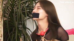 Sexy Asian girl gets tied up and ballgaged