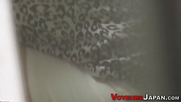 Amateur Asian girl rubs her pussy and moans