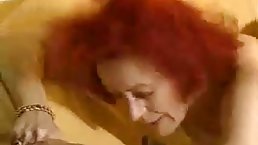 Mature redhead slut gets fucked by young guy