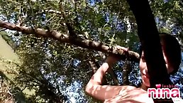 Small tits brunette with tattoo Nina nude in tree