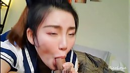 Young Japanese schoolgirl in sexy unuform gives nice blowjob