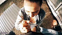 Young brunette babe sucks dick outdoors