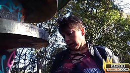 German granny deepthroats in park