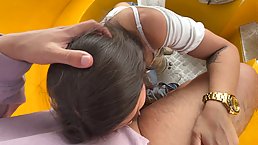 Amateur brunette babe gives public blowjob at ferris wheel